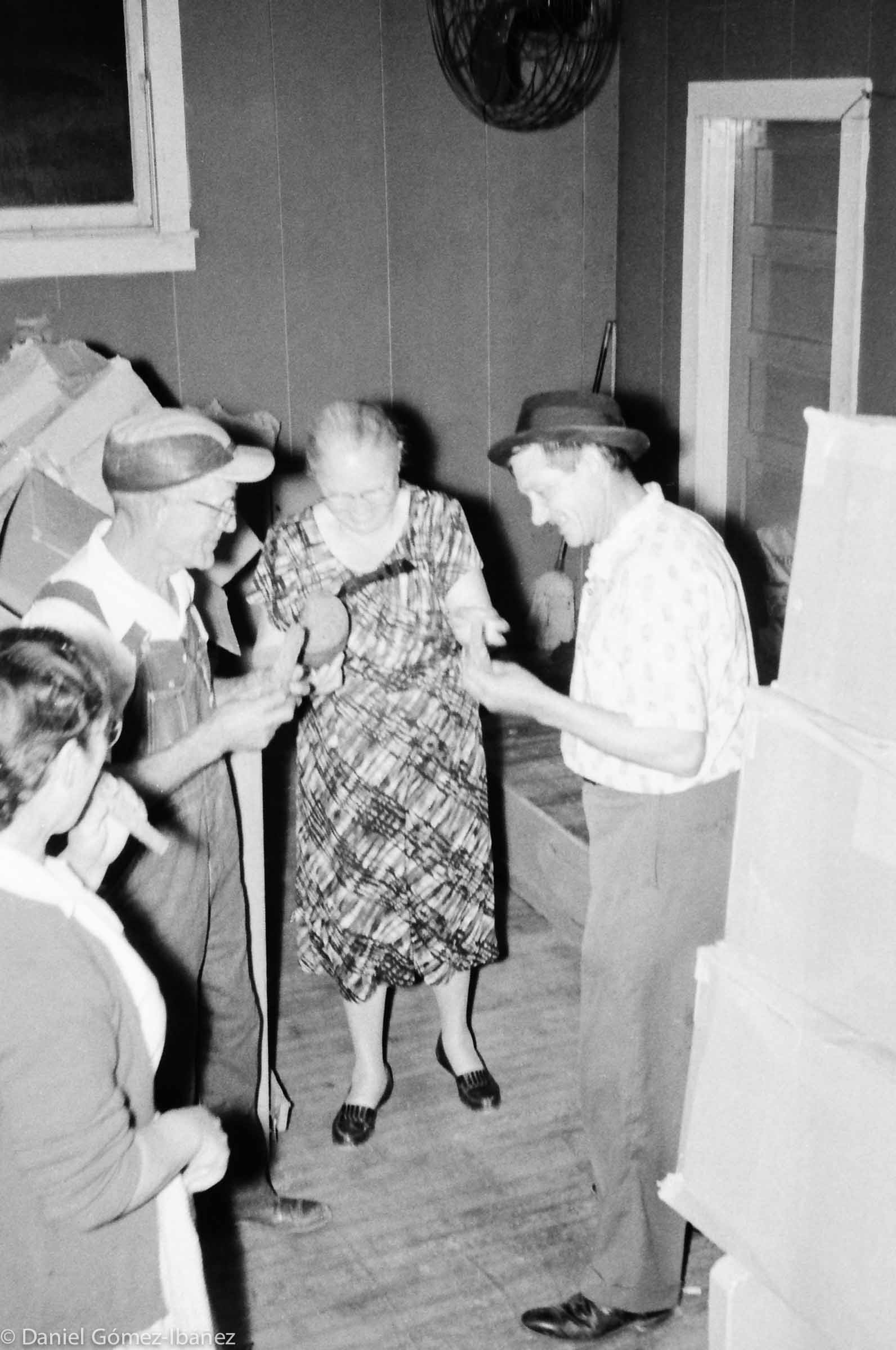 The truck is empty and the hall is full. A miner's wife breaks out a loaf of bread.
