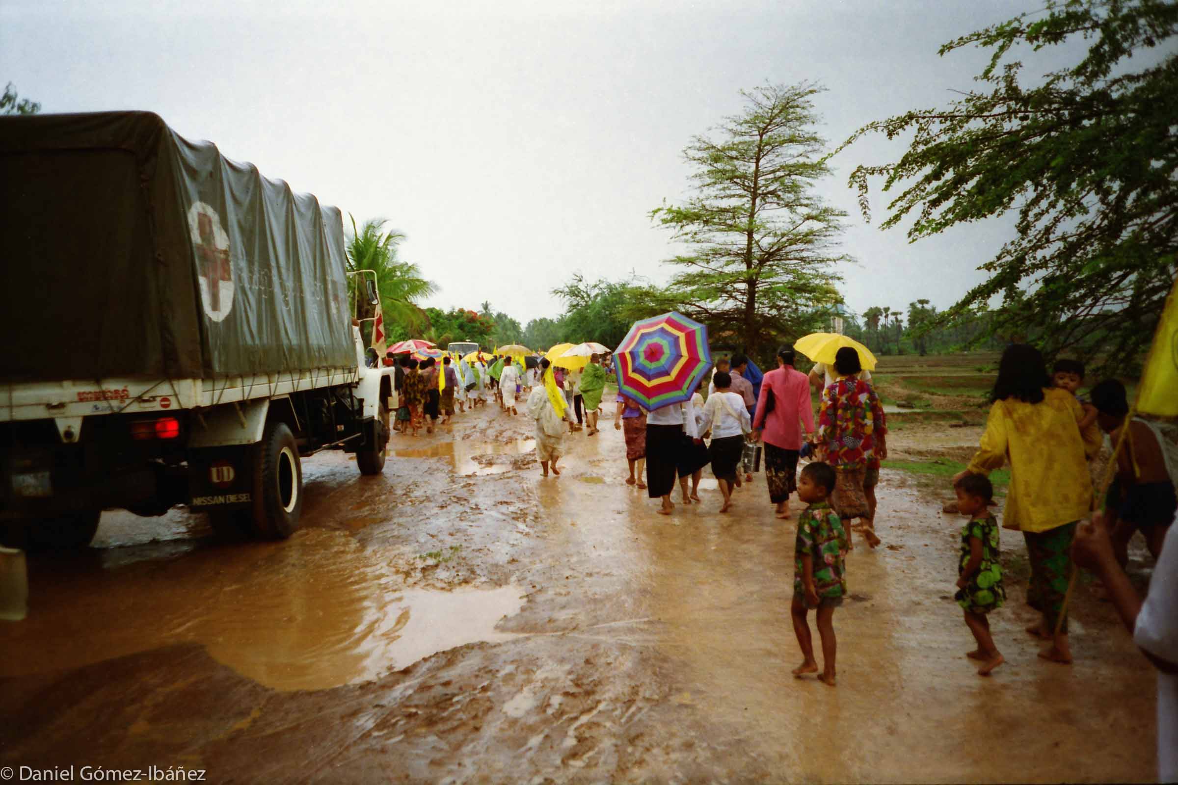 In the second week the monsoon broke. From then on it rained every day. Local villagers were happy to follow the Dhammayietra for a few kilometers. ©1996