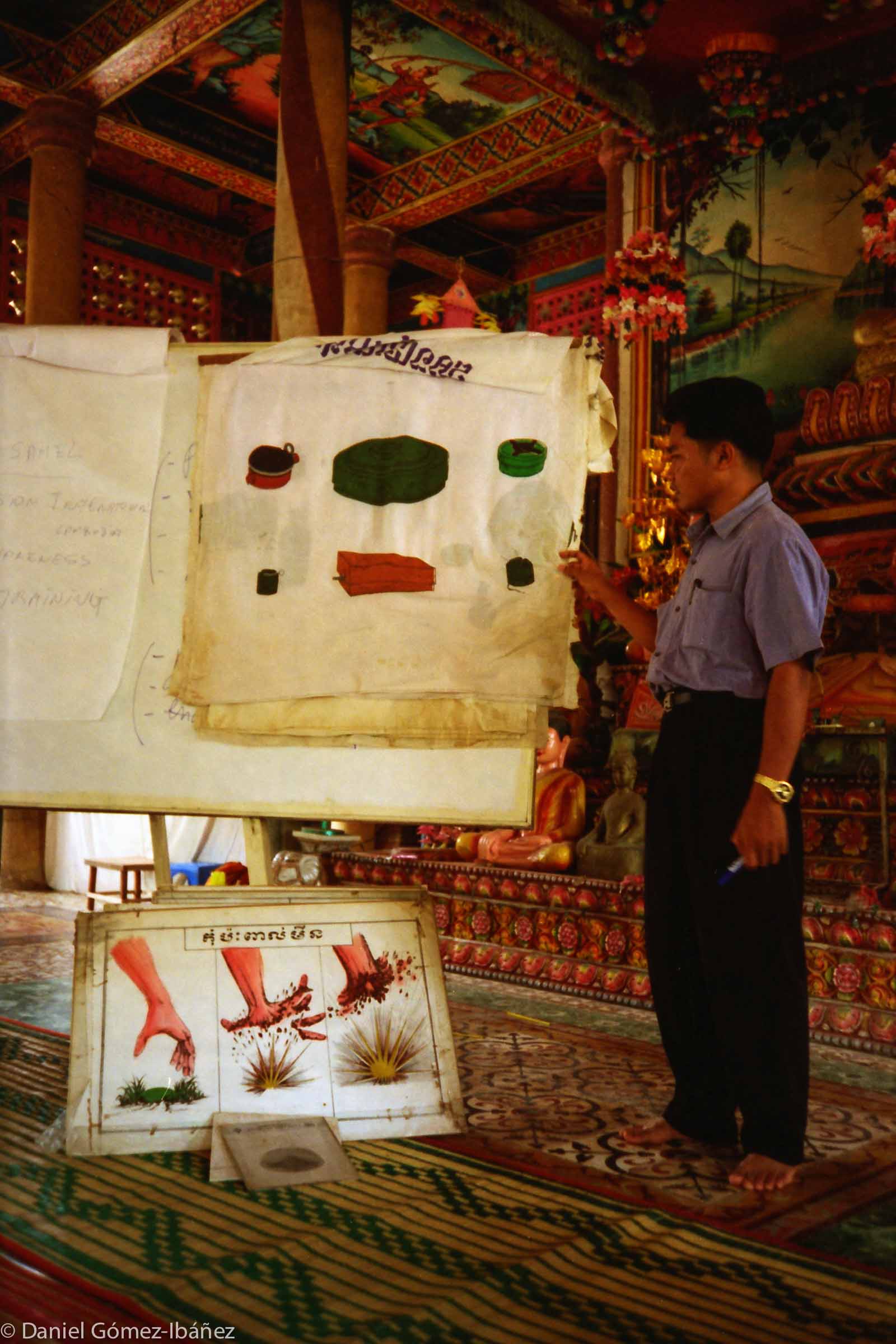 Landmine-awareness training at a pagoda in Cambodia. With over 25,000 amputees, Cambodia has the world's highest per-capita ratio of landmine survivors. Most victims come from rural areas where mines were laid from the late 1970s to the 1990s.  Even as late as 2013 at least six million viable landmines remained in the ground and large areas, especially in the northwest, had not been cleared. ©1996