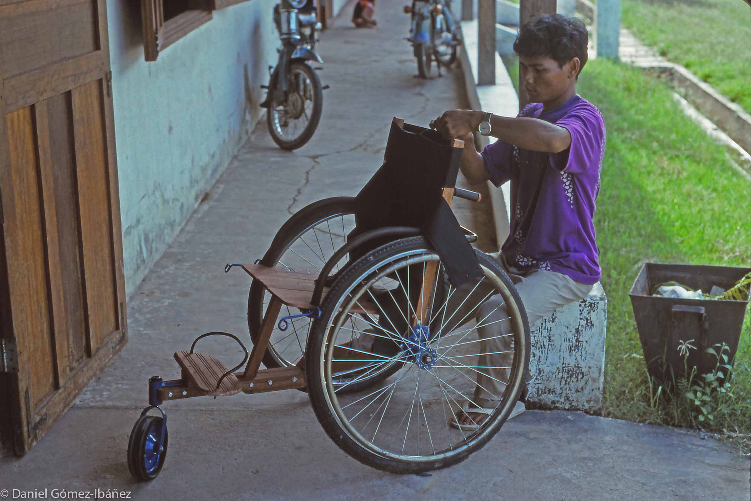 The sturdy and stable tricycle design is adapted to negotiating Cambodia's rough rural roads and tracks. © 1996
