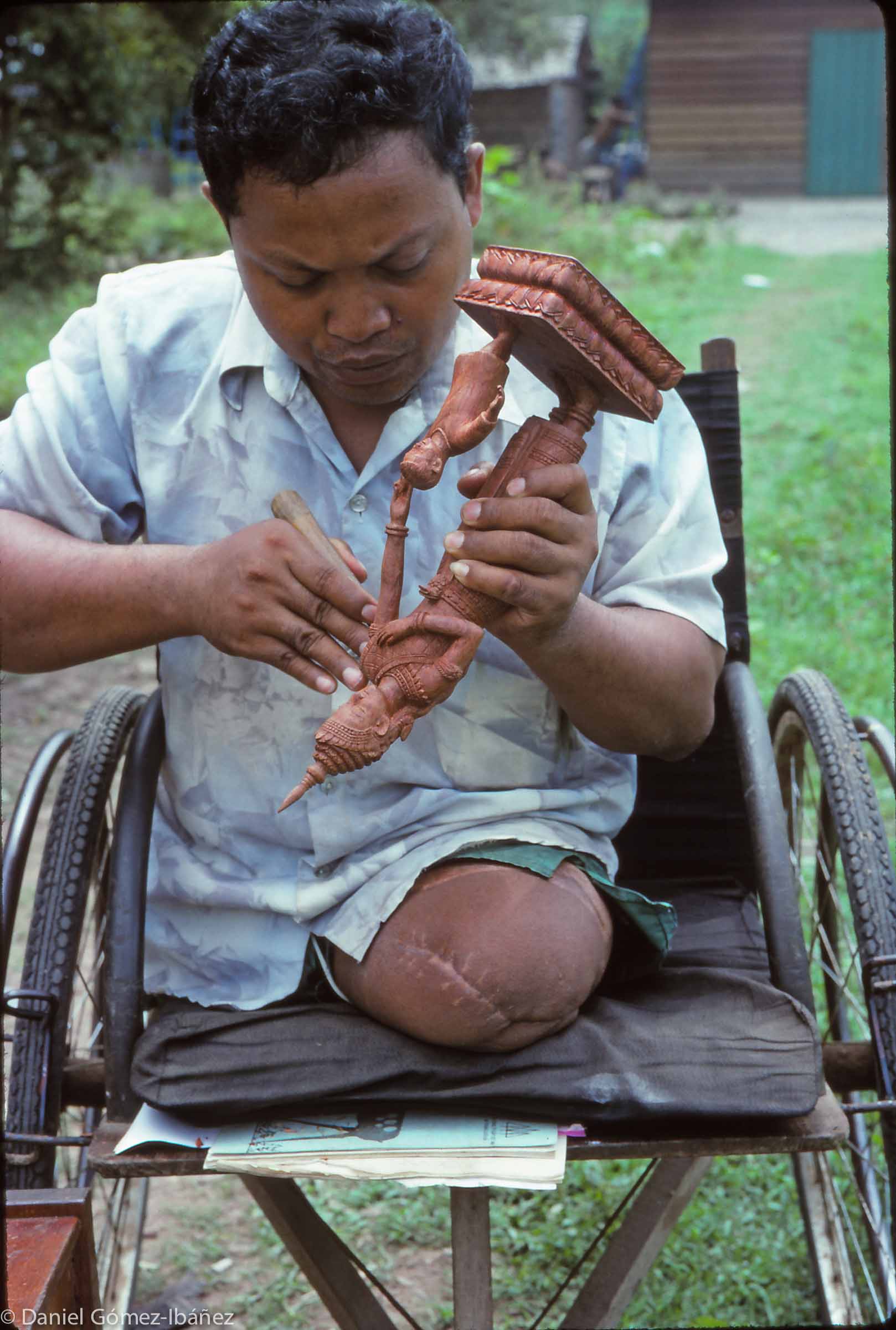For this former farmer traditional wood sculpture offers a new beginning as an artisan. The sculpture course at Banteay Prieb lasts about two years. The intricate carvings are sent to customers around the world. Some are sold to tourists at a shop in downtown Phnom Penh. © 1996
