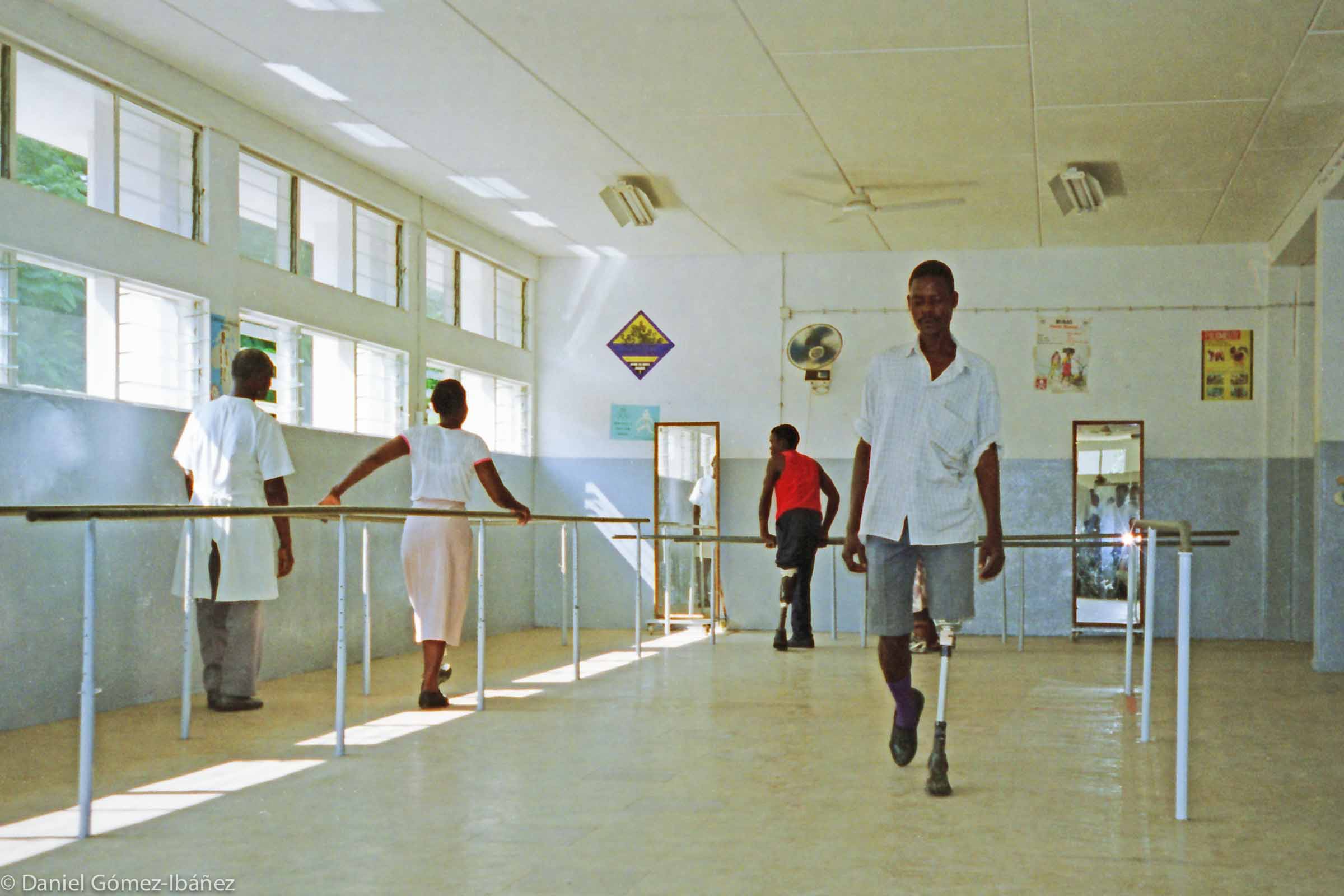 The orthopedic exercise room at Maputo's Central Hospital in Mozambique. Carlos Fabião Pelembe, 37, is learning to walk again. © 1997